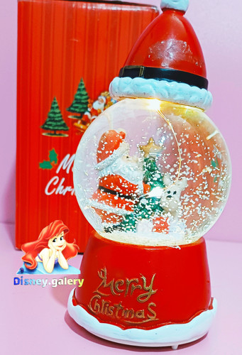 گوی موزیکال برفی مدل بابانوئل و کریسمس سایز متوسط عبهدار اصل ال ای دی دار دارای چند موزیک باطری خور